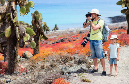 Father with son taking pics in the Galapagos Islands, Ecuador