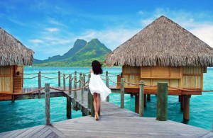 Woman Tahiti over water bungalows French Polynesia 90136030