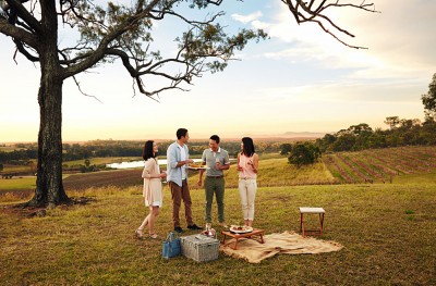 Friends Enjoying a Picnic with Wine in Hunter Valley, Australia