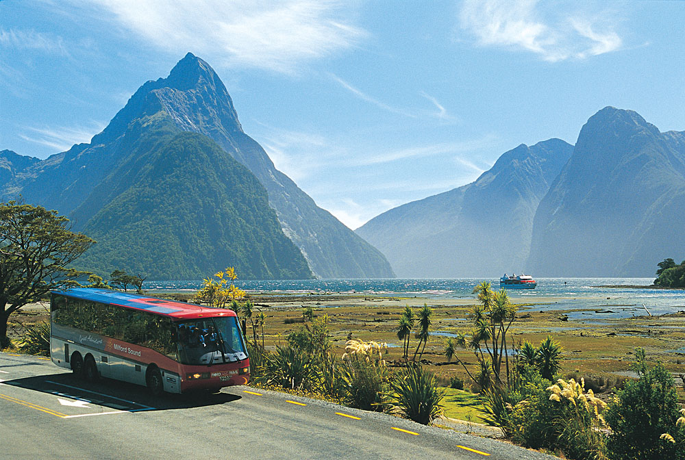 Motorcoach and Milford Mariner at Milford Sound, New Zealand