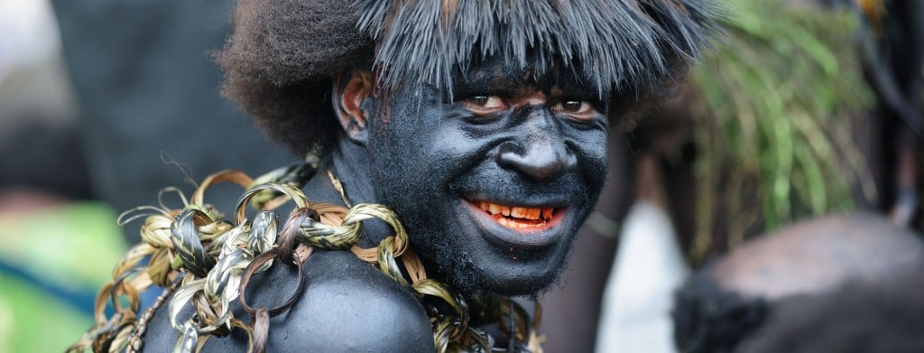 Black painted tribesman, Papua New Guinea