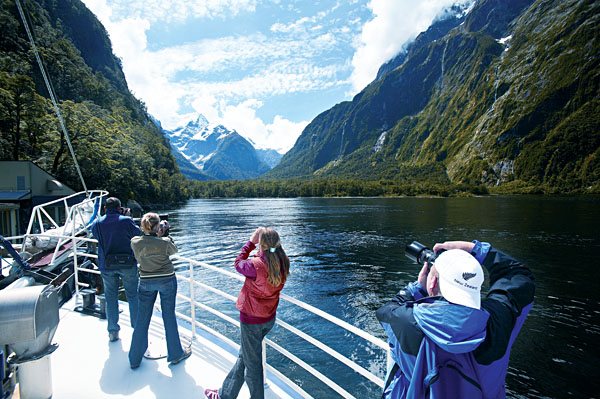 Passengers photographing Milford Sound's beautiful scenery, New Zealand