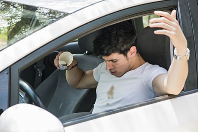Young Male Driver Spilled Coffee on Tshirt_287474531