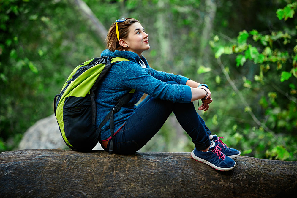 Active Healthy Female Hiker Resting in Beautiful Forest