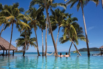 Couple Relaxing in Pool, Tropica Island Resort, Mamanuca Islands, Fiji