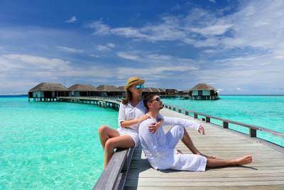 Couple on a Tropical Beach Jetty, Maldives