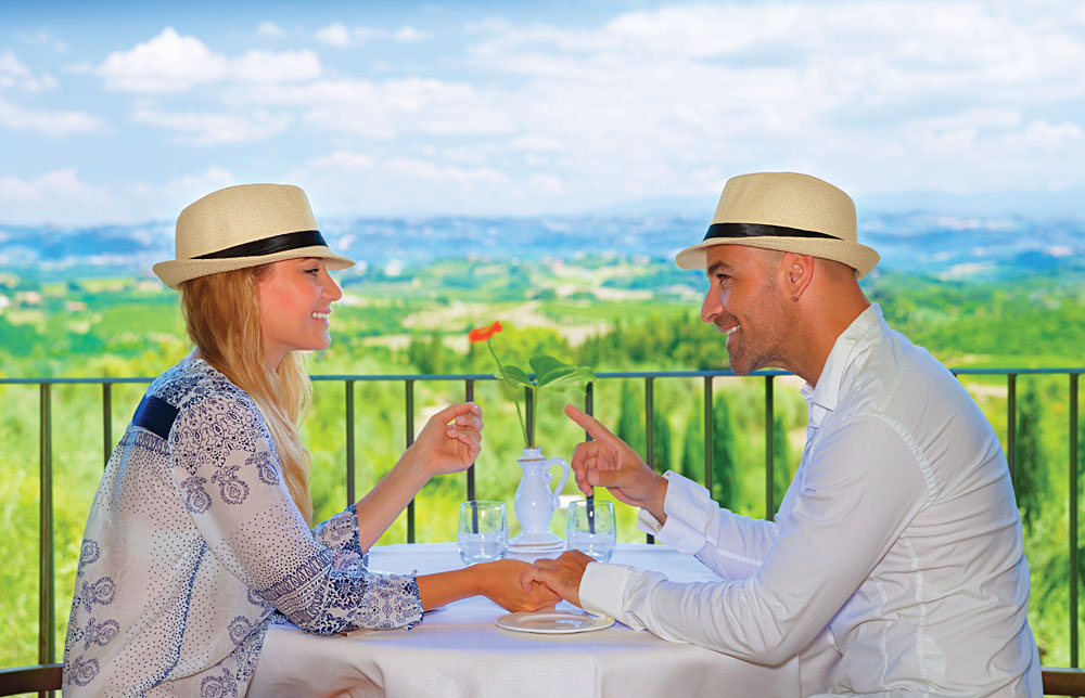 Young Couple Having Breakfast on the Terrace in Tuscany, Italy