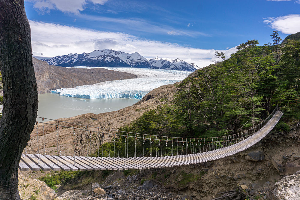 Suspension Bridge over Lago Grey with Glacier Grey in Background, Southern Patagonia, Chile