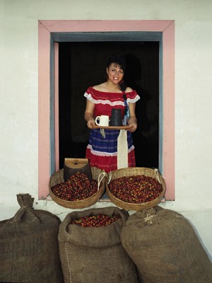 Woman in Traditional Central American Dress Serving Coffee from Window, El Salvador