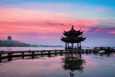 Ancient Pavilion Silhouette at Sunset on the West Lake in Hangzhou, China
