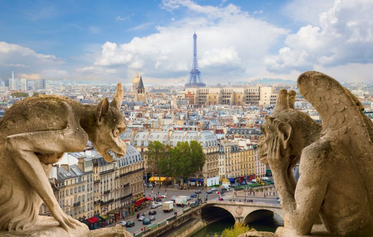 Gargoyle on Notre Dame Cathedral and city of Paris France
