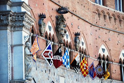 Banners of the Contrades at Piazza del Campo in Siena, Italy