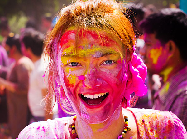 Female Tourist with Students Celebrating Holi, India