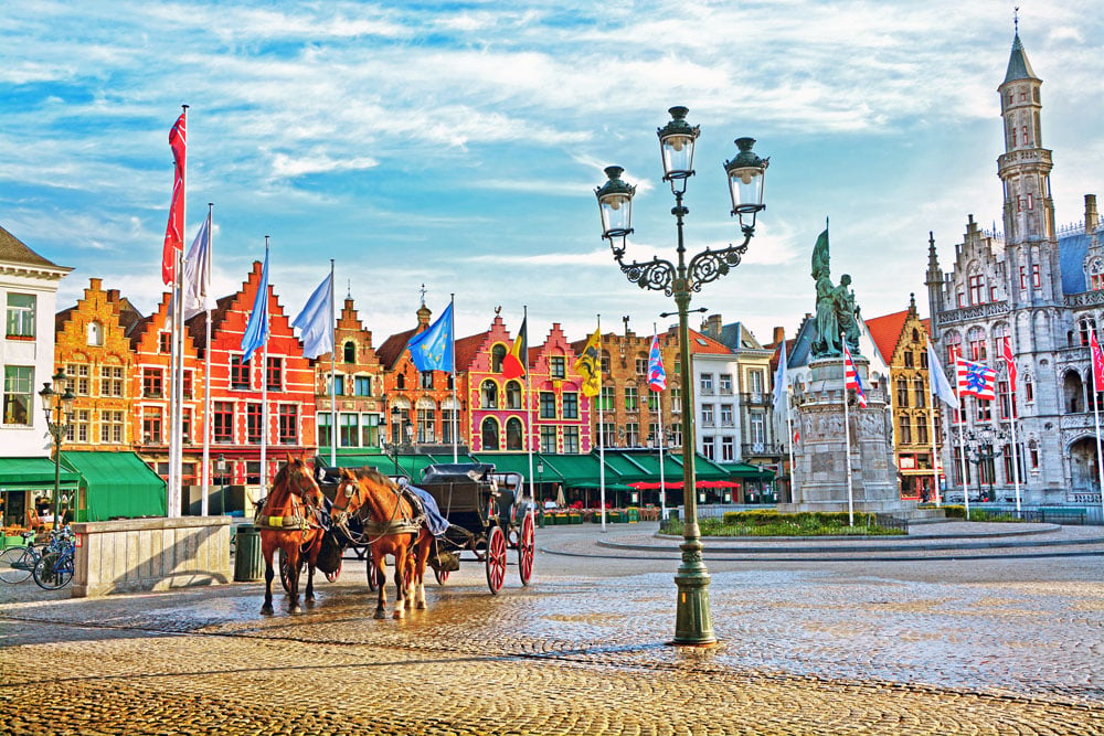 Horse Carriages in Grote Markt Square in Bruges, Belgium