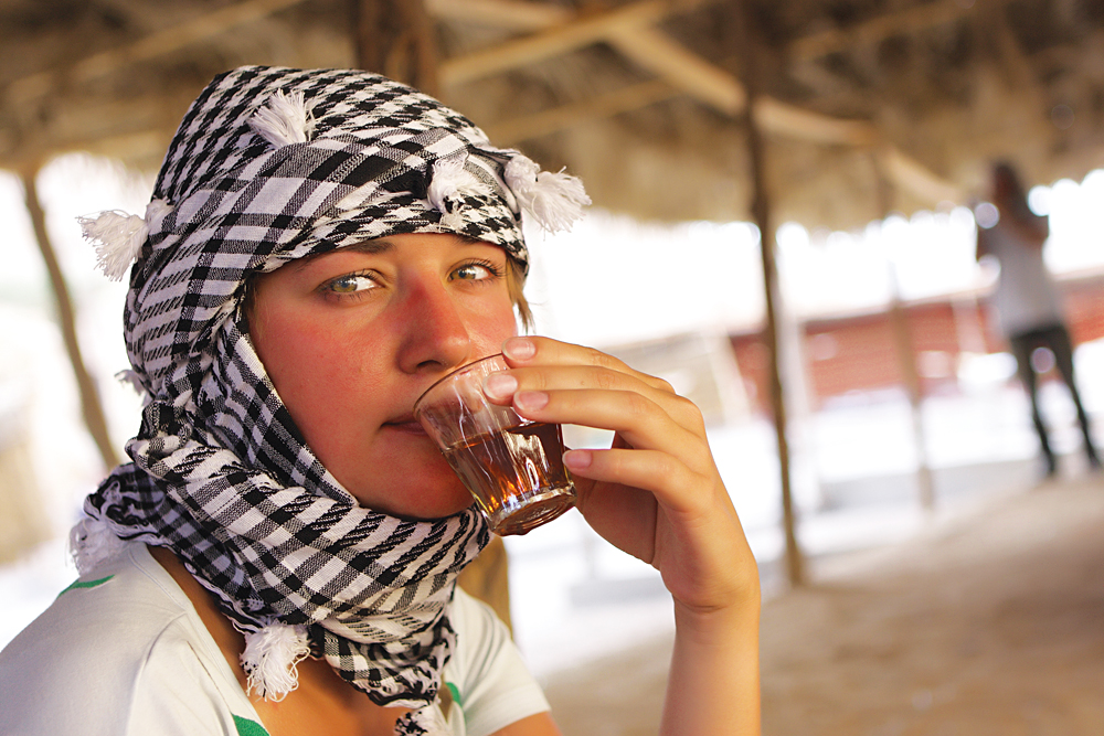 Tourist Drinks Bedouin Tea in Bedouin Tent