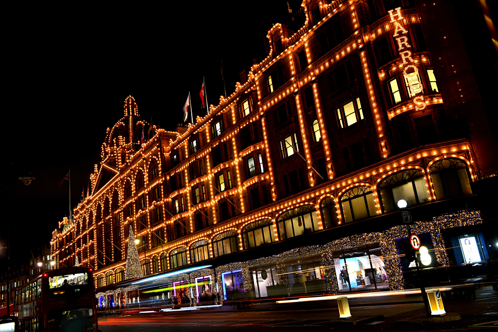 Harrods lit up at night, Knightsbridge, London, England, UK