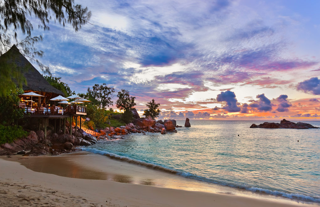 A typical tropical beach sunset in the Seychelles Islands.
