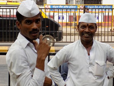 Friendly Dabbawalas in Mumbai, who collectively deliver more than 200,000 lunches per day, Mumbai, India