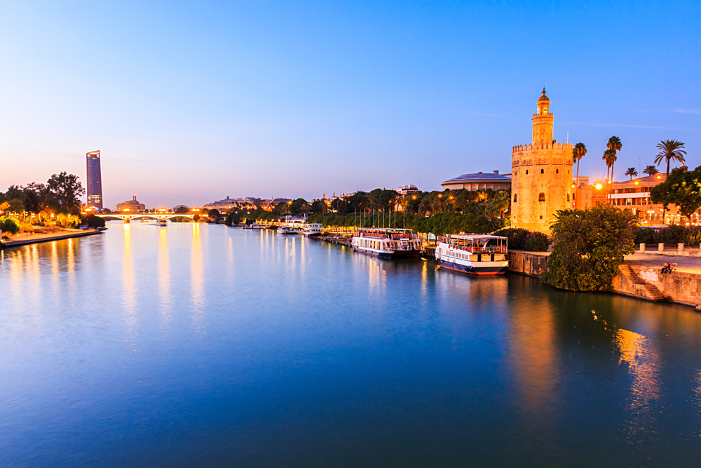 Guadalquivir River and Golden Tower (Torre del Oro), Seville, Andalusia, Spain