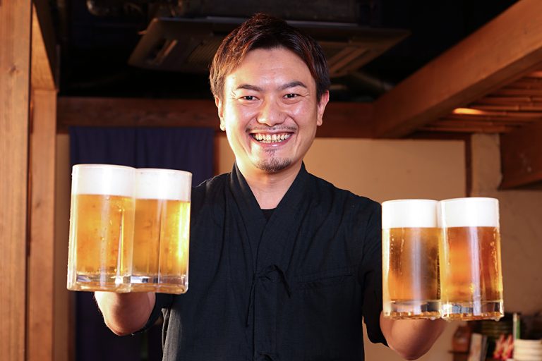 Pub Manager Serving Beer, Japan
