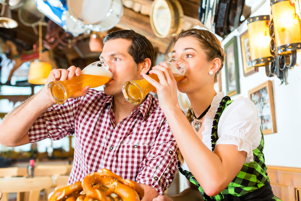Couple drinking Wheat Beer in a Bavarian Restaurant, Munich, Germany