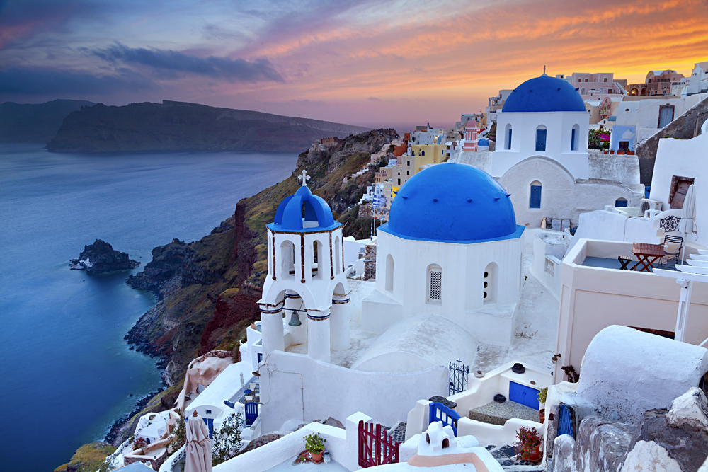 Small Village of Oia at sunset, located on Greek island of Santorini, Greece