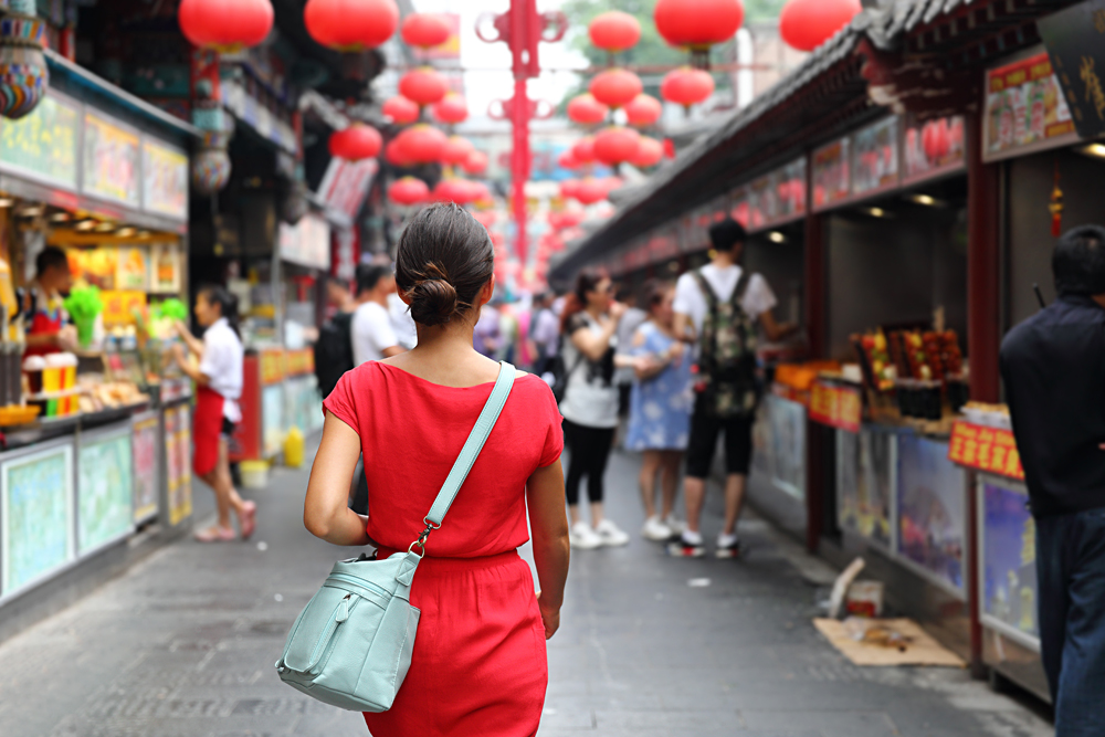 Woman Tourist on Wangfujing food street, Bejing, China