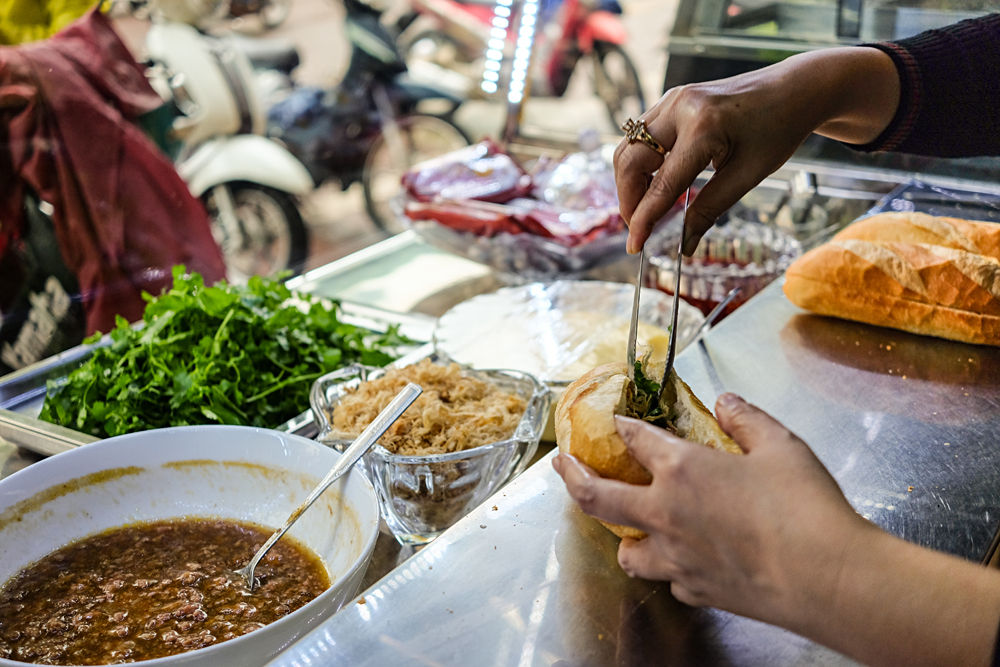 Street food vendour selling Banh Mi, Ho Chi Minh City, Vietnam