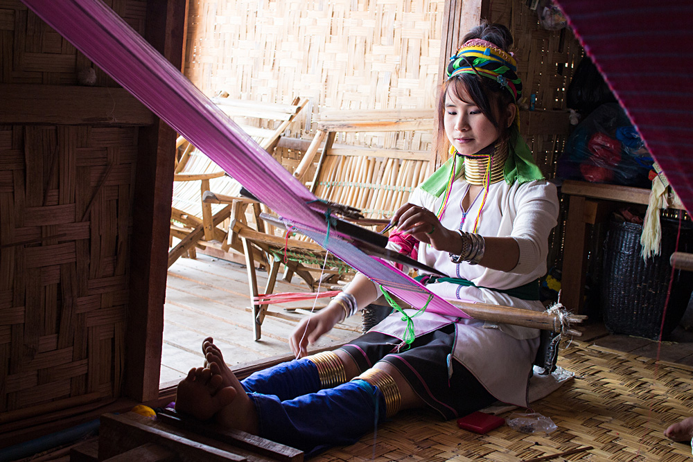 Burmese woman weaving cloth from lotus silk, Inle City, Shan State, Myanmar