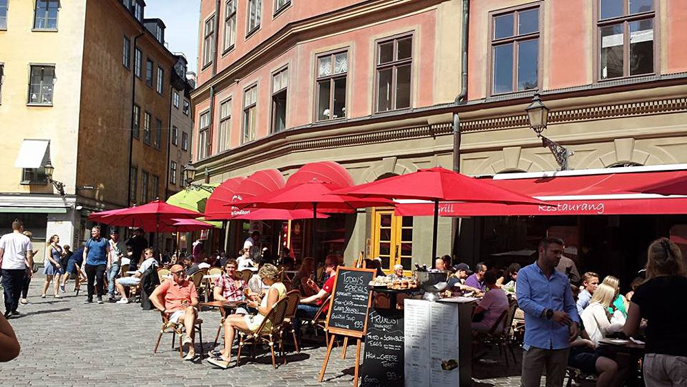 Christian Baines - Dining streetside in Galma Stan, Stockholm, Sweden