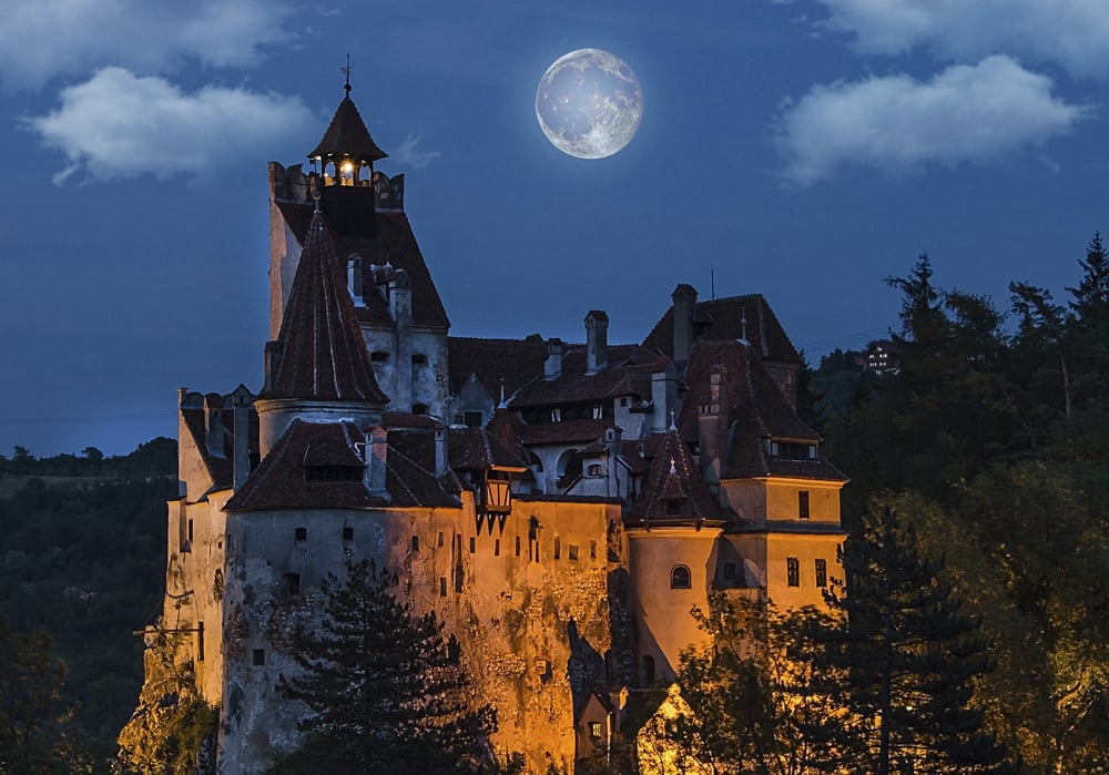 Bran Castle at Night with Full Moon, Transylvania, Romania - Cropped