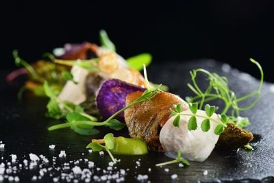 Haute Cuisine - Gourmet food scallops with asparagus and lardo bacon, France