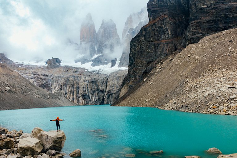 Man standing in front of Torres del Paine, Patagonia, Chile