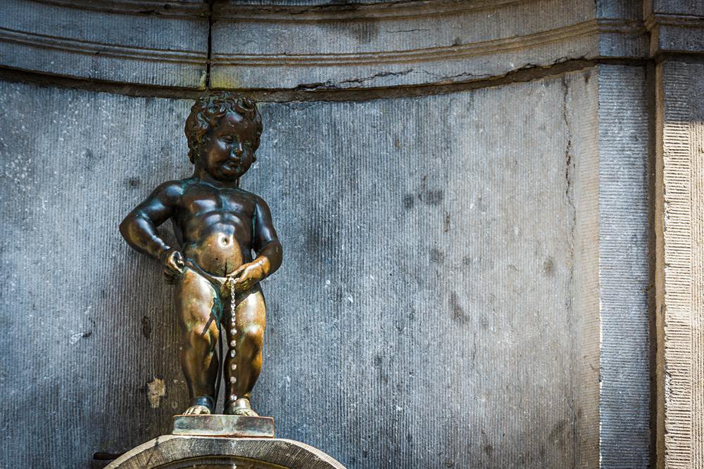 Manneken Pis (Little Man Pee) or le Petit Julien, a landmark small bronze sculpture in Brussels, Belgium