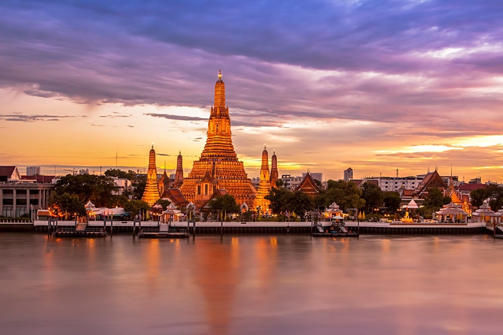 Phra Prang Wat Arun along the Chao Phraya River at twilight, Bangkok, Thailand