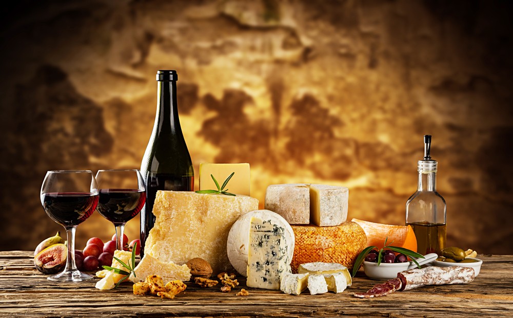 Wine and traditional pieces of french and italy hand-made cheese, France, Italy