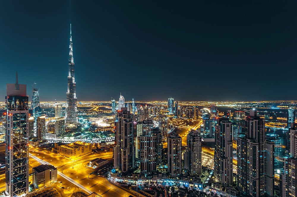 Aerial view of Dubai's business bay and Burj Khalifa at night, Dubai, UAE (United Arab Emirates)