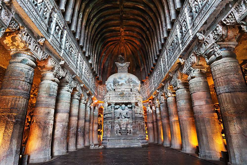 Interior of Ajanta Buddhist Cave with Buddha statue, Maharashtra, India