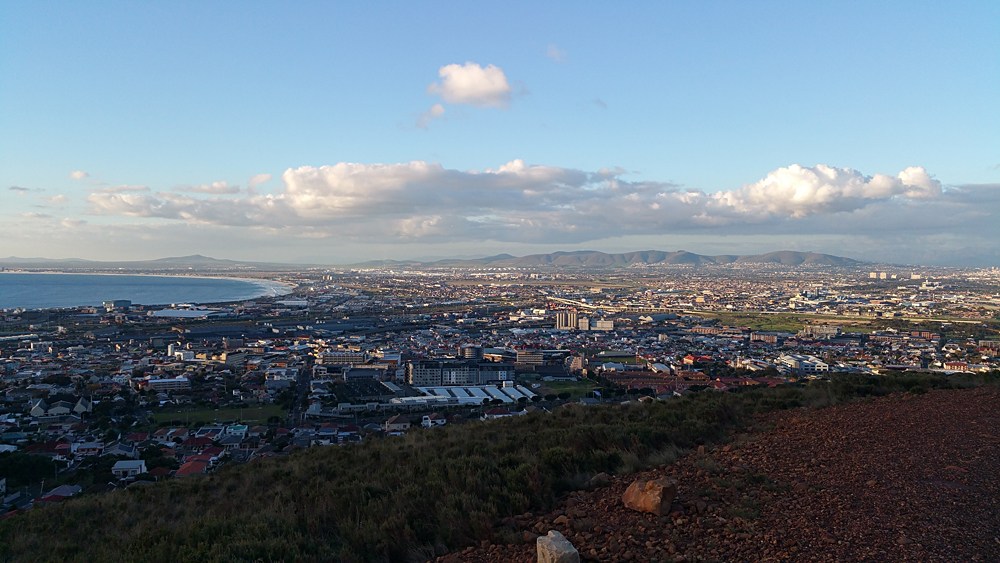 Sunset at Table Bay and northern districts of Cape Town including Woodstock, Western Cape, South Africa