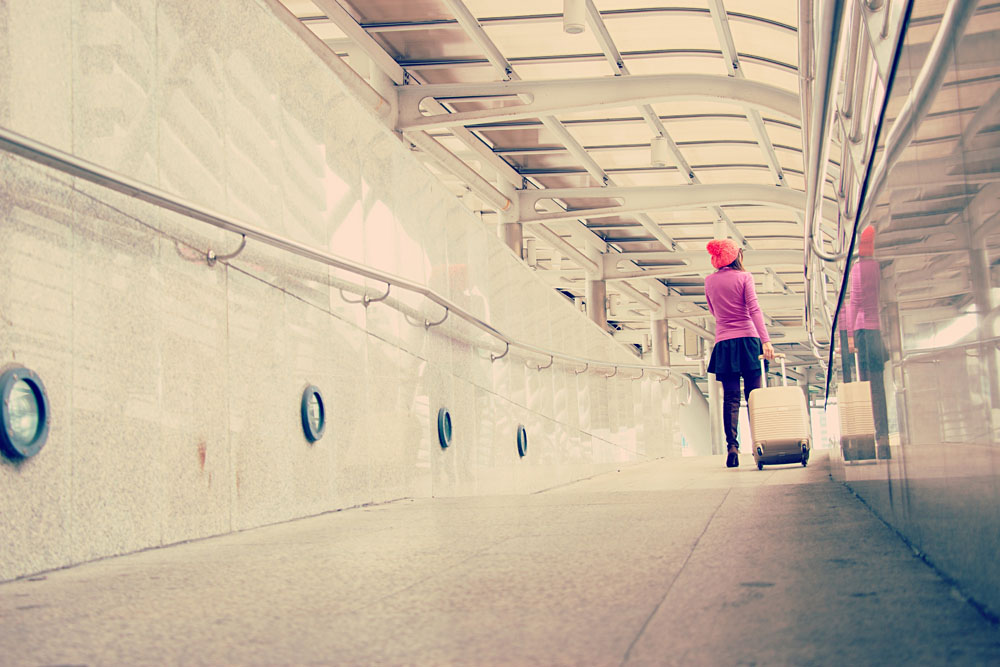 Woman is traveling alone arriving at station