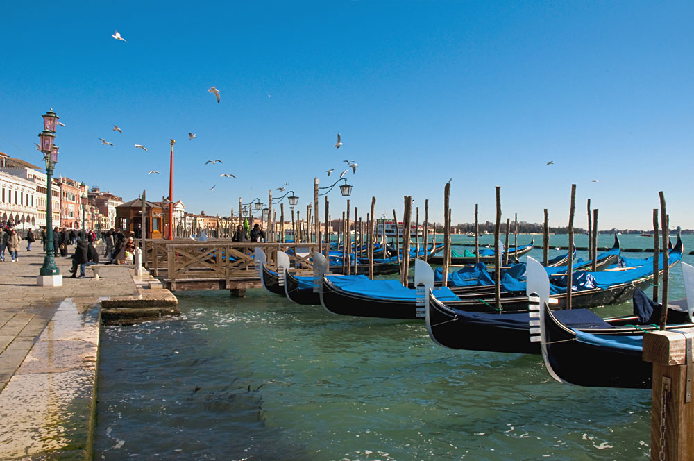 Gondolas at Riva degli Schiavoni at Venice, Italy