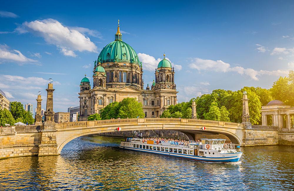 Historic Berlin Cathedral (Berliner Dom) at Museum Island with Friedrichsbrucke bridge on Spree River, Berlin, Germany
