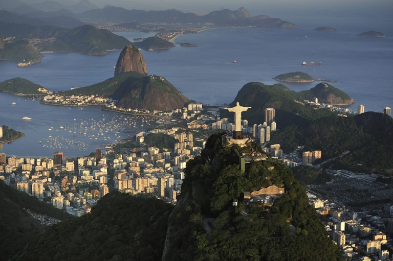 Christ the Redeemer statue on top of Corcovado Hill, overlooking Guanabara Bay and Sugarloaf, Rio de Janeiro, Brazil