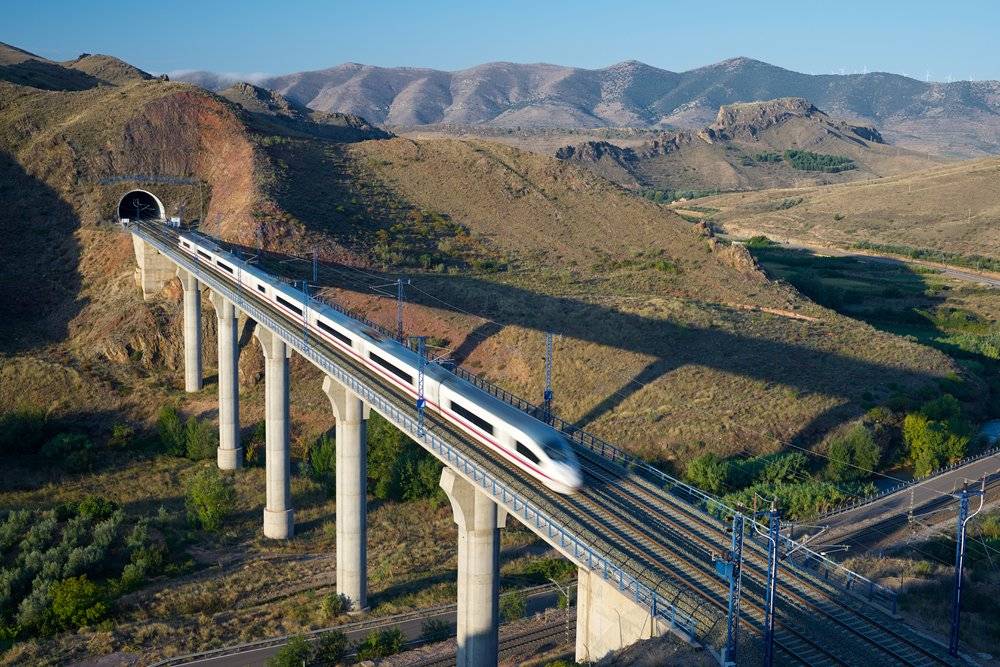 Aerial view of AVE Madrid Barcelona high-speed train crossing a viaduct in Purroy, Zaragoza, Aragon, Spain