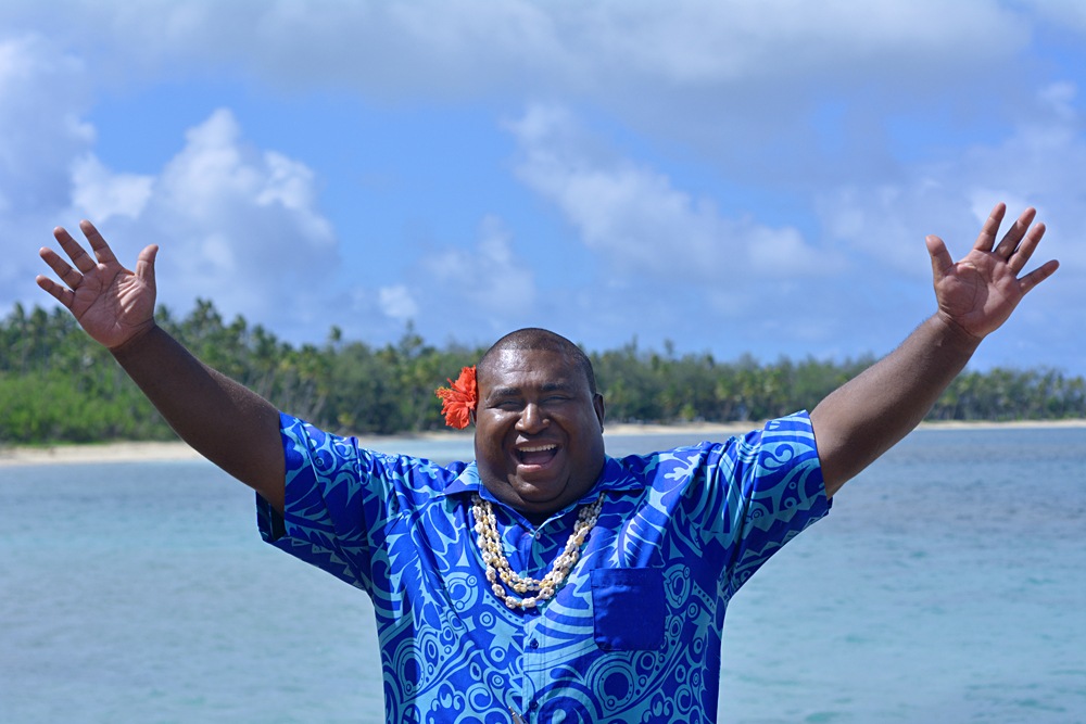 Bula greeting from Fijian man against the Blue Lagoon on Nanuya Lailai Island, Yasawa Islands, Fiji