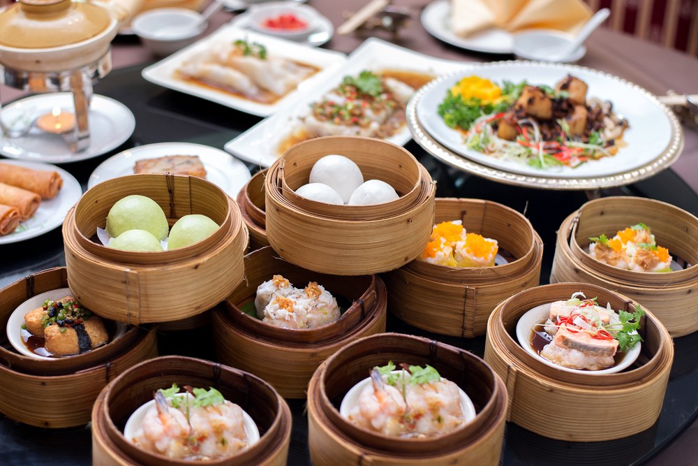 Arrangment of various dim sum in bamboo steamers, Asia 