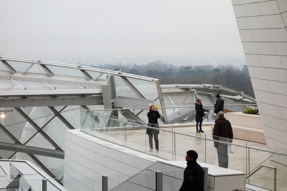 Tourists visiting the Fondation Louis Vuitton arts centre, Paris, France 