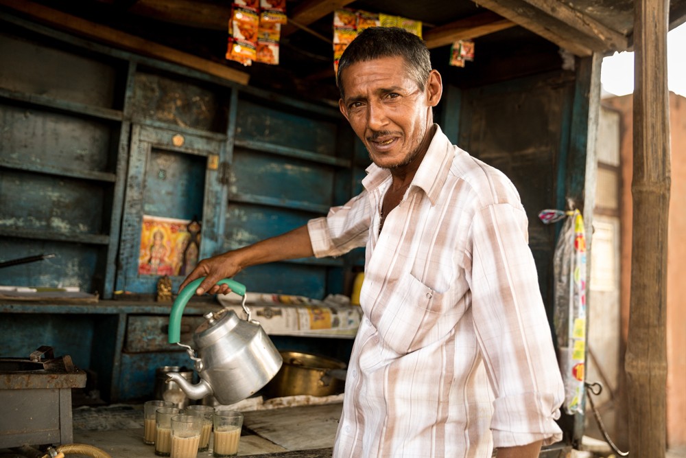Indian man preparing Masala Tea, India 