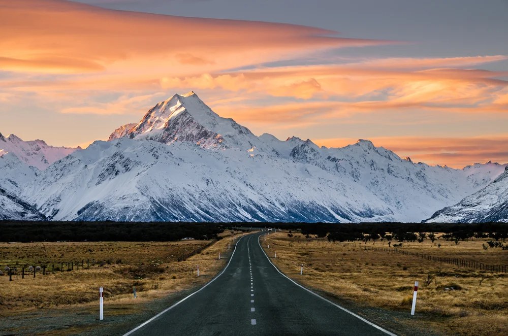 View of the majestic Aoraki Mount Cook with the road leading to Mount Cook Village, New Zealand 