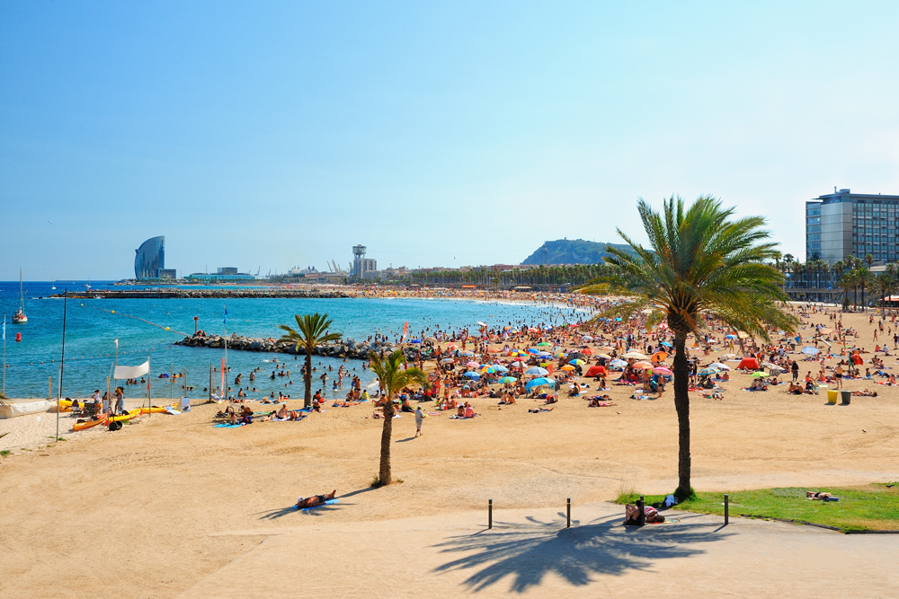 Barcelona beach in La Barcenoleta on a summer day, Barcelona, Spain 